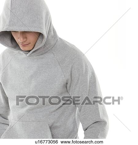 Teenage boy wearing a hoodie View Large Photo Image Stock Photograph - Teenage boy wearing a hoodie. Fotosearch