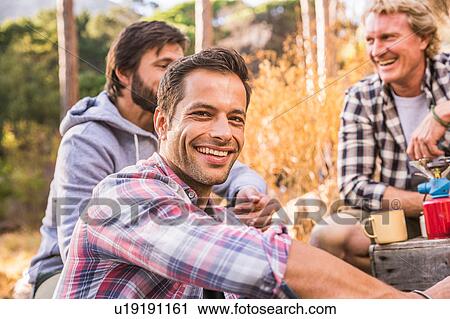 Three men cooking on camping stove in forest, Deer Park, Cape Town, South Africa View Large Photo Image Stock Image - Three men cooking on camping stove in forest, Deer Park, Cape Town, South Africa. Fotosearch
