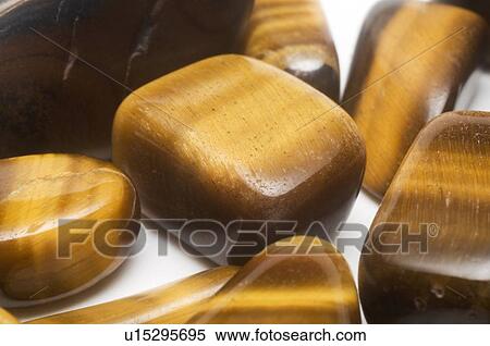 Tiger eye ochre gemstones View Large Photo Image Stock Photography - Tiger eye ochre gemstones. Fotosearch