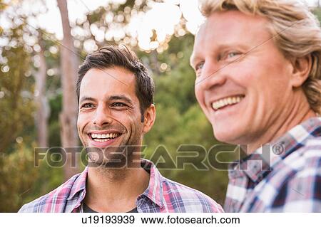 Stock Photo - Two happy male hikers in forest, Deer Park, Cape Town, South Africa. Fotosearch