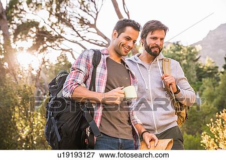 Two male hikers preparing for hike in forest, Deer Park, Cape Town, South Africa View Large Photo Image Stock Photo - Two male hikers preparing for hike in forest, Deer Park, Cape Town, South Africa. Fotosearch