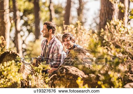 Two male hikers sitting drinking coffee in forest, Deer Park, Cape Town, South Africa View Large Photo Image Stock Photograph - Two male hikers sitting drinking coffee in forest, Deer Park, Cape Town, South Africa. Fotosearch
