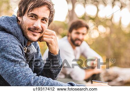 Two men sitting in forest drinking coffee, Deer Park, Cape Town, South Africa View Large Photo Image Stock Image - Two men sitting in forest drinking coffee, Deer Park, Cape Town, South Africa. Fotosearch