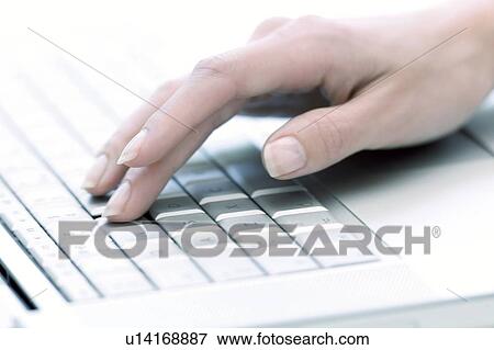 Stock Photo - Typing on a laptop. Fotosearch