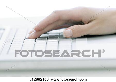 Typing on a laptop View Large Photo Image Stock Photograph - Typing on a laptop. Fotosearch