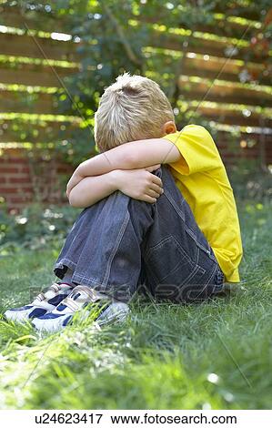 Unhappy boy View Large Photo Image Stock Photo - Unhappy boy. Fotosearch