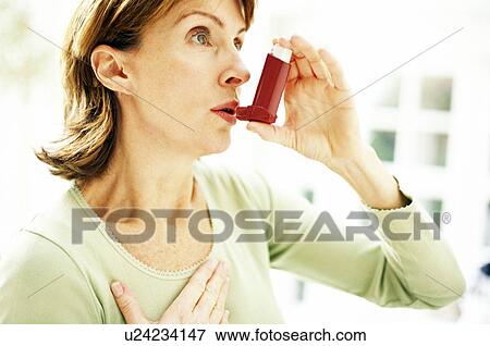 Using asthma inhaler View Large Photo Image Stock Photo - Using asthma inhaler. Fotosearch