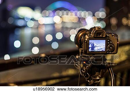 Stock Image - View of Millennium bridge through back of digital camera, Newcastle, UK. Fotosearch