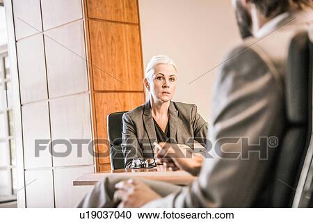 View over shoulder of businesswoman in meeting View Large Photo Image Stock Image - View over shoulder of businesswoman in meeting. Fotosearch