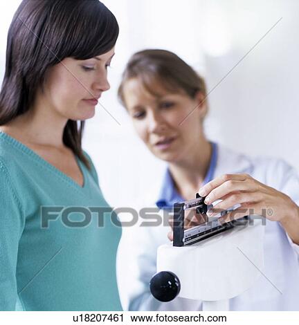 Stock Image - Weight check-up. Fotosearch