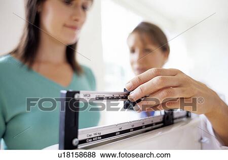 Stock Photo - Weight check-up. Fotosearch