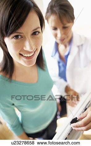 Weight check-up View Large Photo Image Stock Photo - Weight check-up. Fotosearch