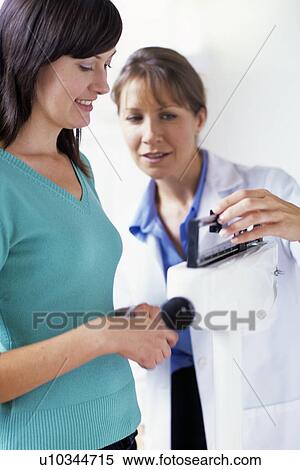 Stock Photography - Weight check-up. Fotosearch