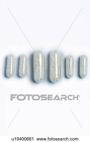 Stock Image - White capsules. Fotosearch