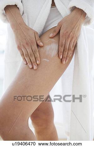 Woman applying moisturiser View Large Photo Image Stock Image - Woman applying moisturiser. Fotosearch