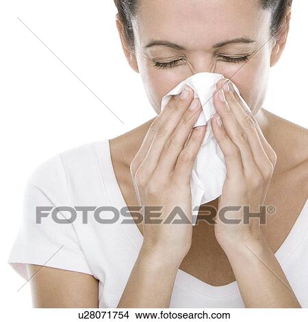 Picture - Woman blowing her nose. Fotosearch
