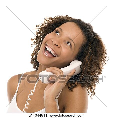 Woman chatting on a phone View Large Photo Image Stock Image - Woman chatting on a phone. Fotosearch