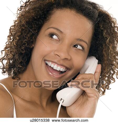 Stock Photo - Woman chatting on a phone. Fotosearch