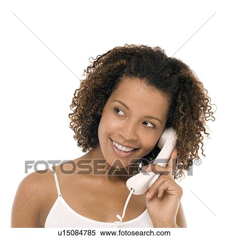 Woman chatting on a phone View Large Photo Image Stock Photography - Woman chatting on a phone. Fotosearch