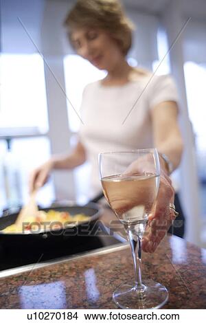 Picture - Woman cooking. Fotosearch
