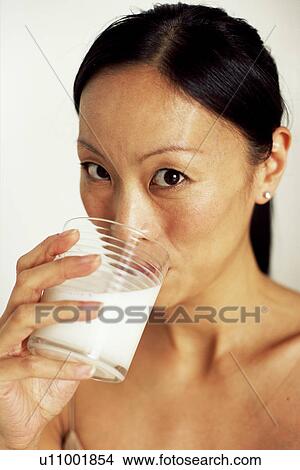 Woman drinking milk View Large Photo Image Picture - Woman drinking milk. Fotosearch