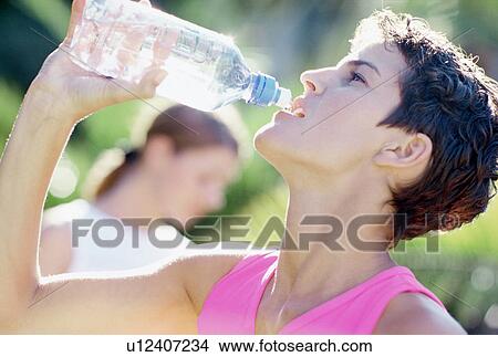 Picture - Woman drinking water. Fotosearch