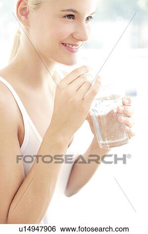 Woman drinking water View Large Photo Image Stock Photograph - Woman drinking water. Fotosearch
