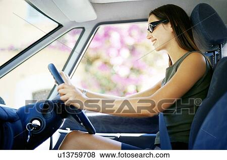 Woman driving View Large Photo Image Stock Photo - Woman driving. Fotosearch
