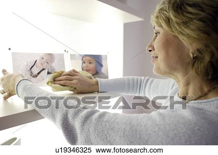 Woman dusting View Large Photo Image Stock Photography - Woman dusting. Fotosearch