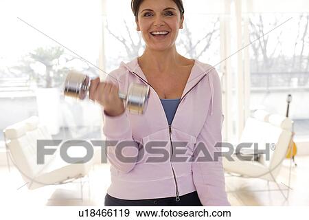Woman exercising View Large Photo Image Stock Photo - Woman exercising. Fotosearch