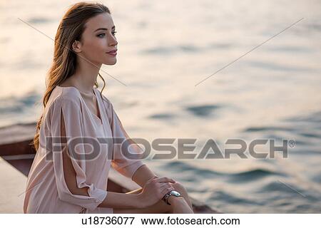 Woman gazing from boat at Dubai marina, United Arab Emirates View Large Photo Image Stock Photo - Woman gazing from boat at Dubai marina, United Arab Emirates. Fotosearch