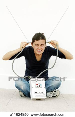 Woman joking while doing DIY View Large Photo Image Stock Image - Woman joking while doing DIY. Fotosearch