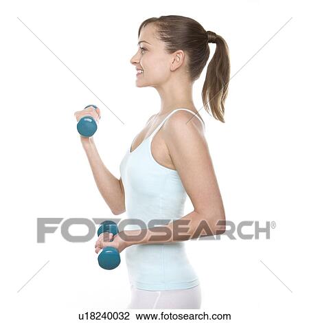 Stock Image - Woman lifting weights. Fotosearch