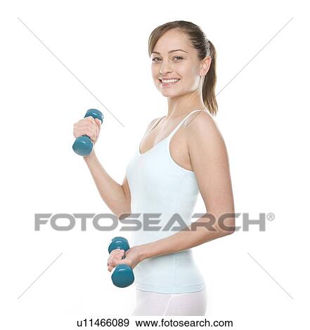 Stock Photo - Woman lifting weights. Fotosearch