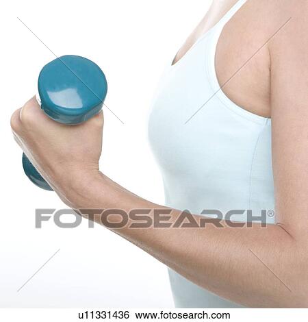 Stock Photograph - Woman lifting weights. Fotosearch