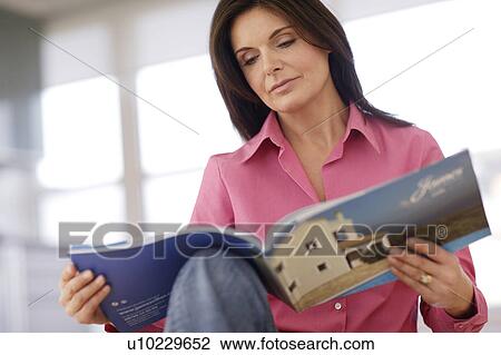 Stock Image - Woman reading. Fotosearch