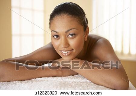 Stock Image - Woman relaxing at a beauty spa. Fotosearch