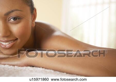 Stock Image - Woman relaxing at a beauty spa. Fotosearch