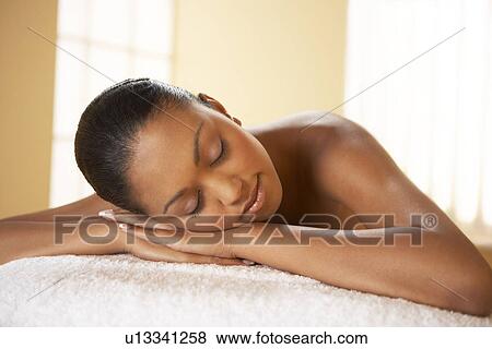 Stock Photo - Woman relaxing at a beauty spa. Fotosearch