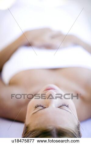 Stock Photo - Woman relaxing at a spa. Fotosearch