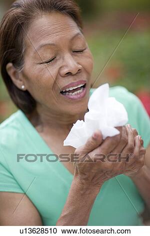Woman sneezing View Large Photo Image Stock Image - Woman sneezing. Fotosearch