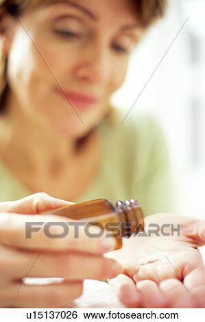 Woman taking painkiller View Large Photo Image Stock Photograph - Woman taking painkiller. Fotosearch