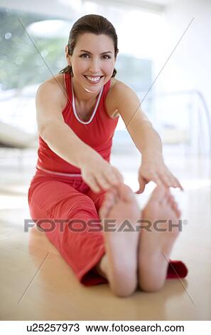 Woman touching her toes View Large Photo Image Stock Image - Woman touching her toes. Fotosearch