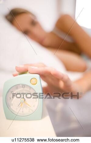 Woman waking up View Large Photo Image Stock Photo - Woman waking up. Fotosearch