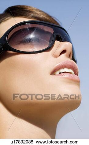 Stock Photography - Woman wearing sunglasses. Fotosearch