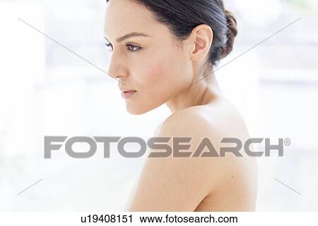 Stock Image - Woman with brown hair, portrait. Fotosearch