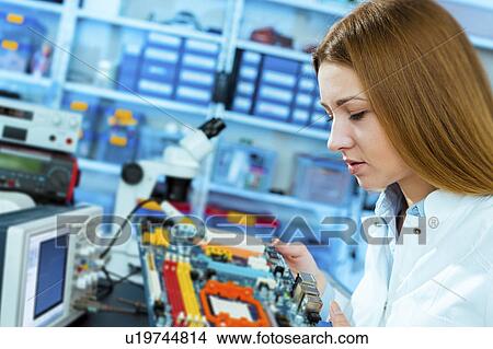 Picture - Woman working in a lab. Fotosearch