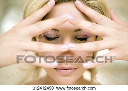 Stock Image - Woman's eyes closed. Fotosearch