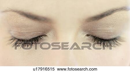 Stock Photography - Woman's eyes closed. Fotosearch