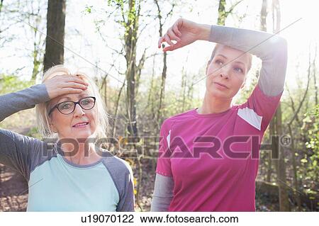 Women in forest hand on forehead looking exhausted View Large Photo Image Stock Image - Women in forest hand on forehead looking exhausted. Fotosearch